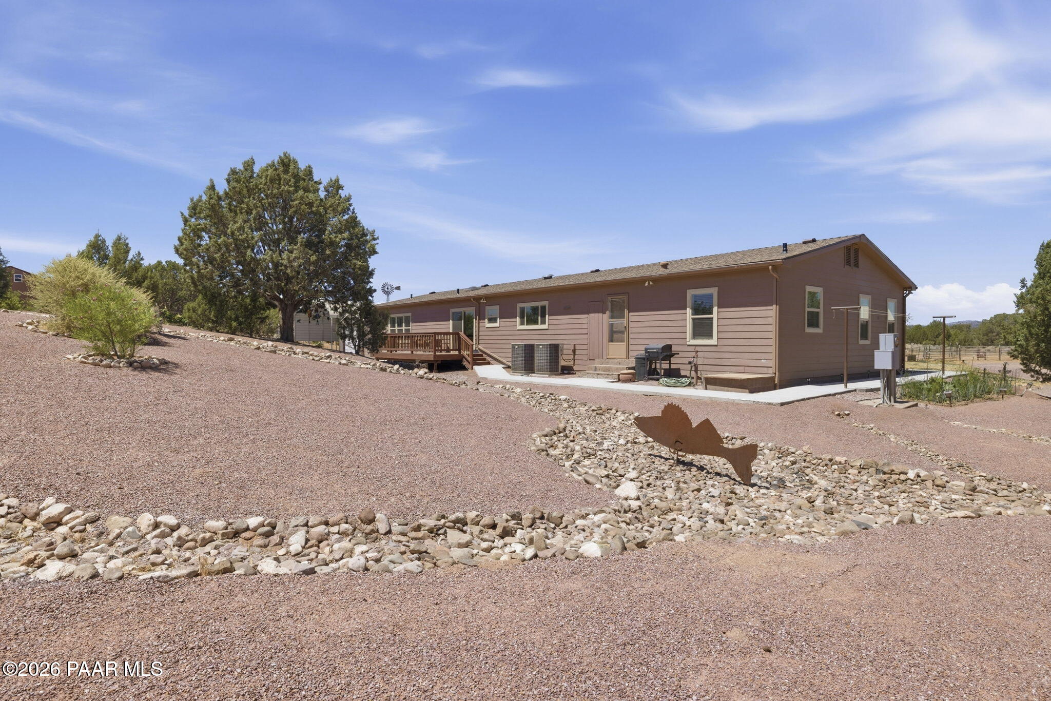 875 West Little Ranch Road Paulden, AZ 86334 - Photo 24 of 51 a front view of a house with a dirt yard and covered with snow