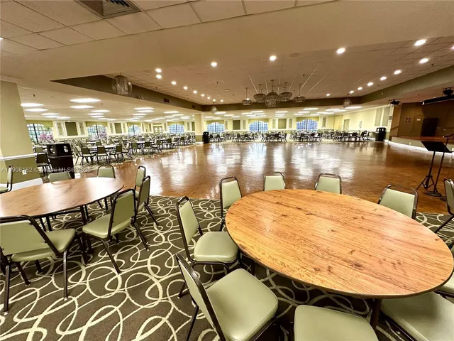 a dining room with a table and chairs