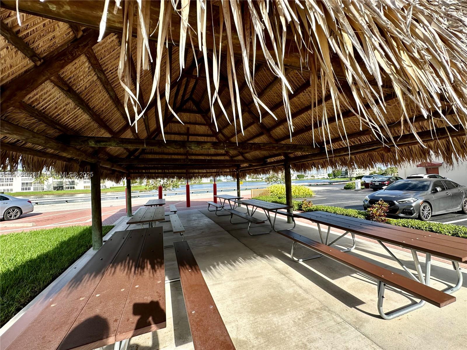 142 Preston F, Unit 142 Boca Raton, FL 33434 - Photo 18 of 23 a view of a backyard with sitting area