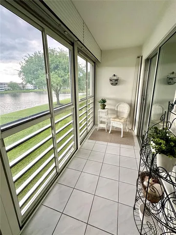 a view of a room with a large window