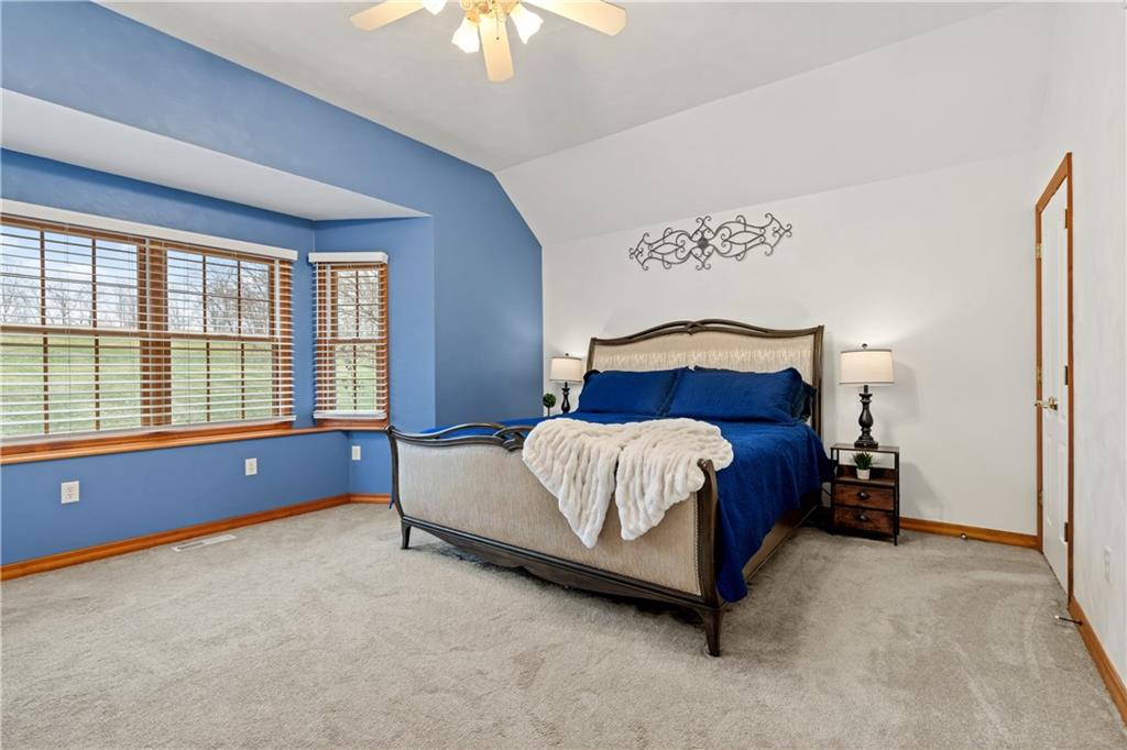 2108 Mickanin Road Irwin, PA 15642 - Photo 15 of 31 a bed sitting in a bedroom next to a window