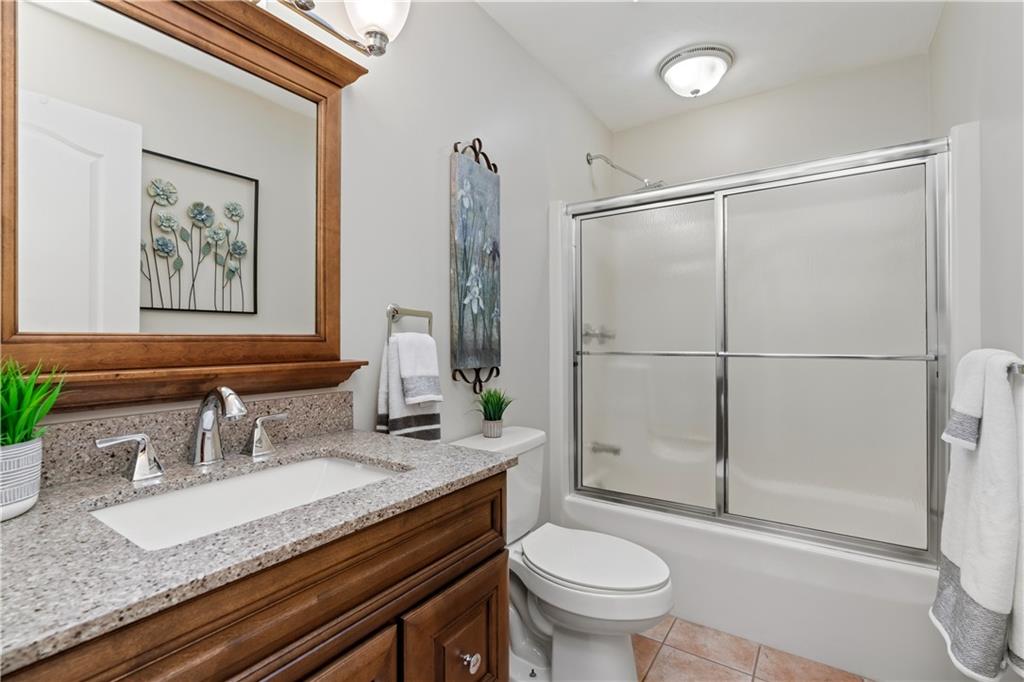 2108 Mickanin Road Irwin, PA 15642 - Photo 18 of 31 a bathroom with a granite countertop sink toilet and shower