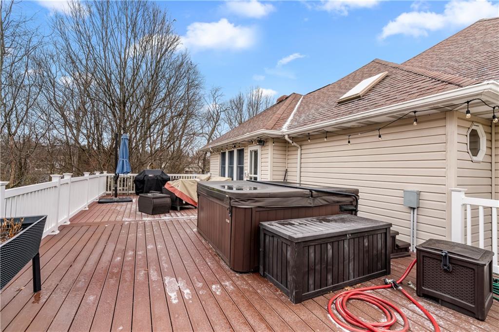 2108 Mickanin Road Irwin, PA 15642 - Photo 20 of 31 a view of a patio with table and chairs with wooden floor and fence
