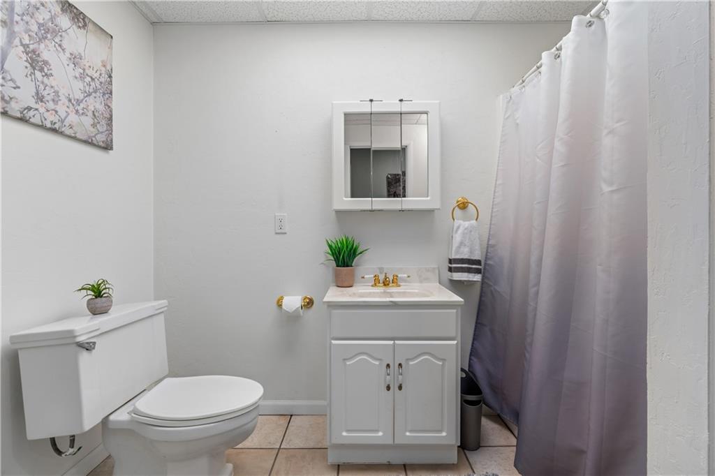 2108 Mickanin Road Irwin, PA 15642 - Photo 24 of 31 a bathroom with a sink a toilet and a mirror