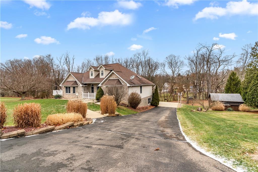 2108 Mickanin Road Irwin, PA 15642 - Photo 3 of 31 a view of a house with a yard and sitting area
