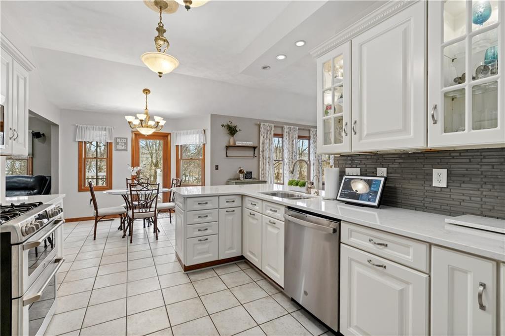 2108 Mickanin Road Irwin, PA 15642 - Photo 9 of 31 a kitchen with white cabinets and appliances