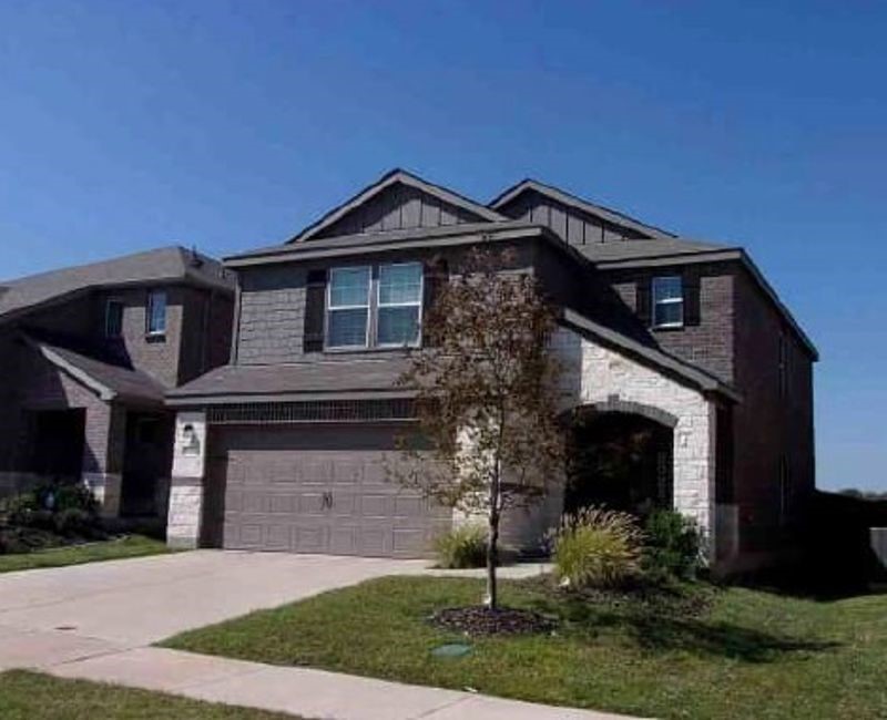 838 Ozark Path Princeton, TX 75407 - Photo 2 of 6 a front view of a house with a yard and garage