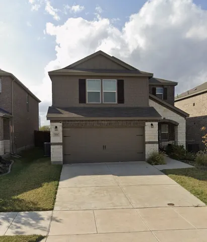 a front view of a house with yard