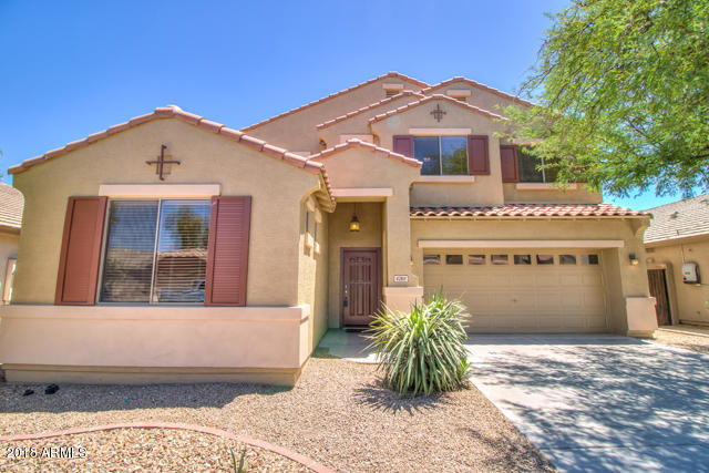 42811 West Venture Road Maricopa, AZ 85138 - Photo 1 of 61 a front view of a house with garden