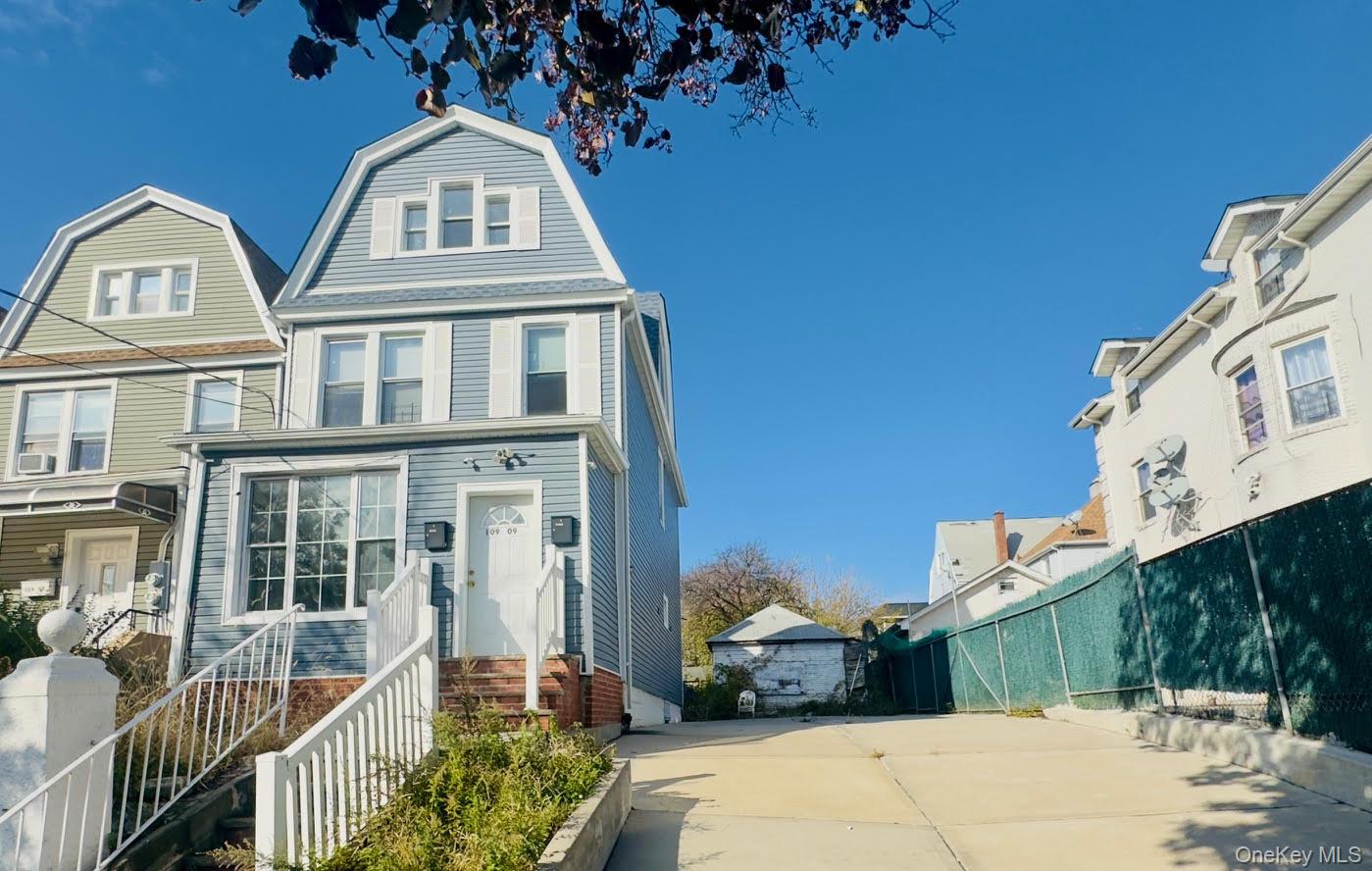 a front view of a house with parking