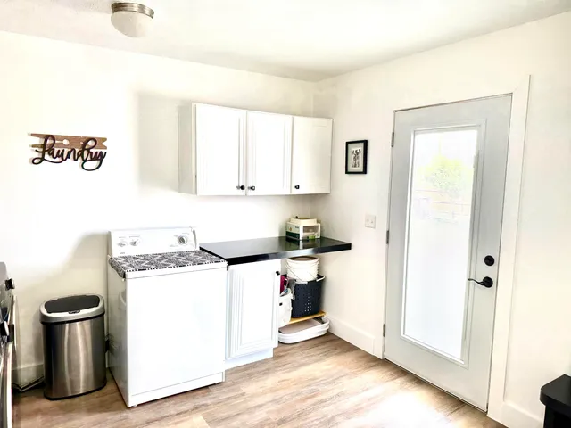 a view of a room with furniture and a chandelier