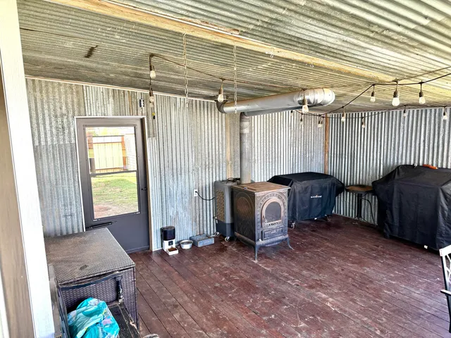 a living room with a couch and a table with wooden floor