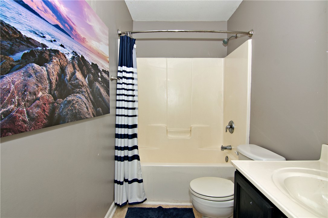 305 North Chestnut Street Seneca, SC 29678 - Photo 32 of 44 Functional tub and shower combination with clean fixtures awaits a personal touch.