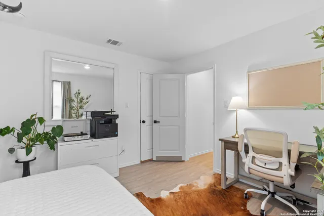 a kitchen with granite countertop a refrigerator a stove and a sink