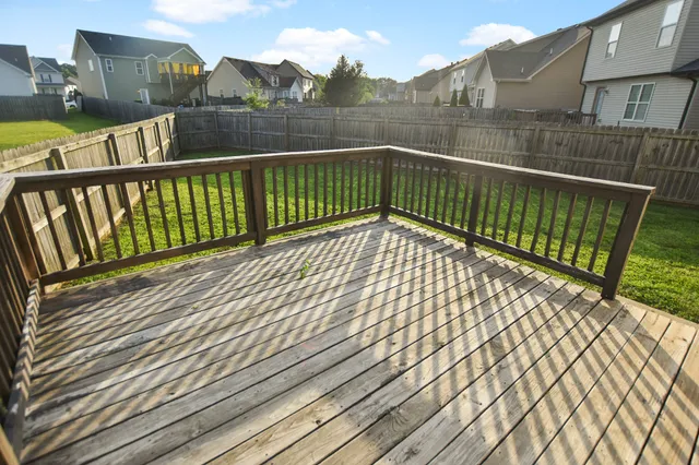 a view of balcony with wooden floor