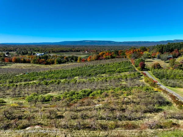 an aerial view of a houses with a yard