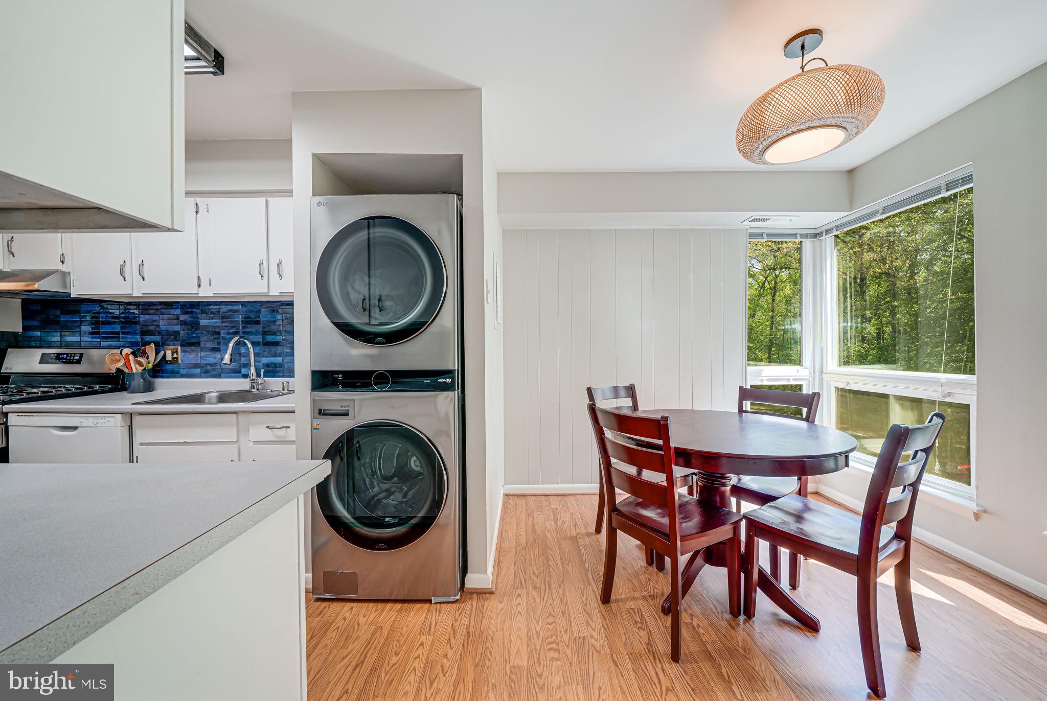 11220 Chestnut Grove Square, Unit 222 Reston, VA 20190 - Photo 12 of 35 a view of a dining room with furniture and a wooden floor