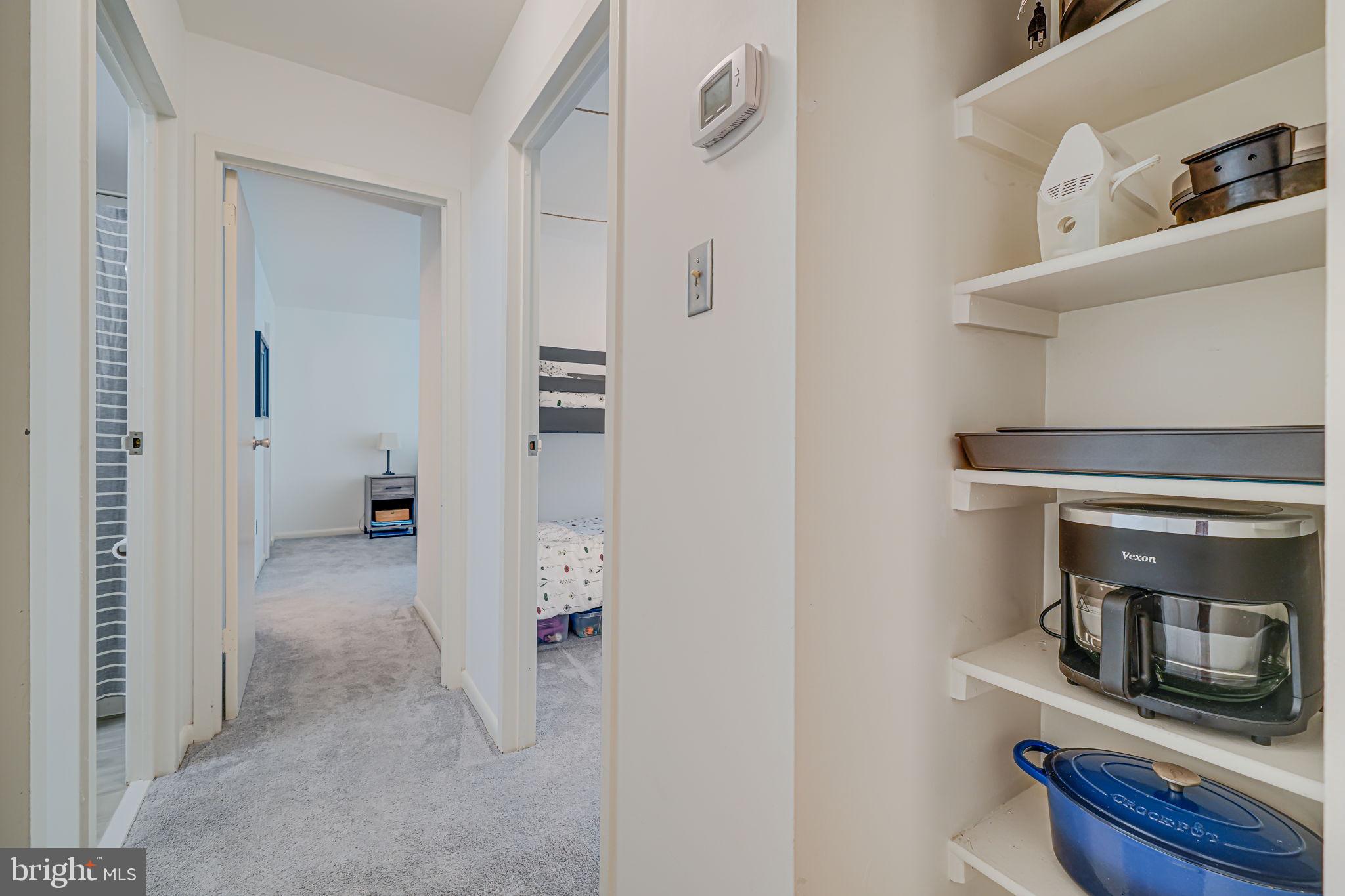 11220 Chestnut Grove Square, Unit 222 Reston, VA 20190 - Photo 18 of 35 a view of a kitchen from the hallway