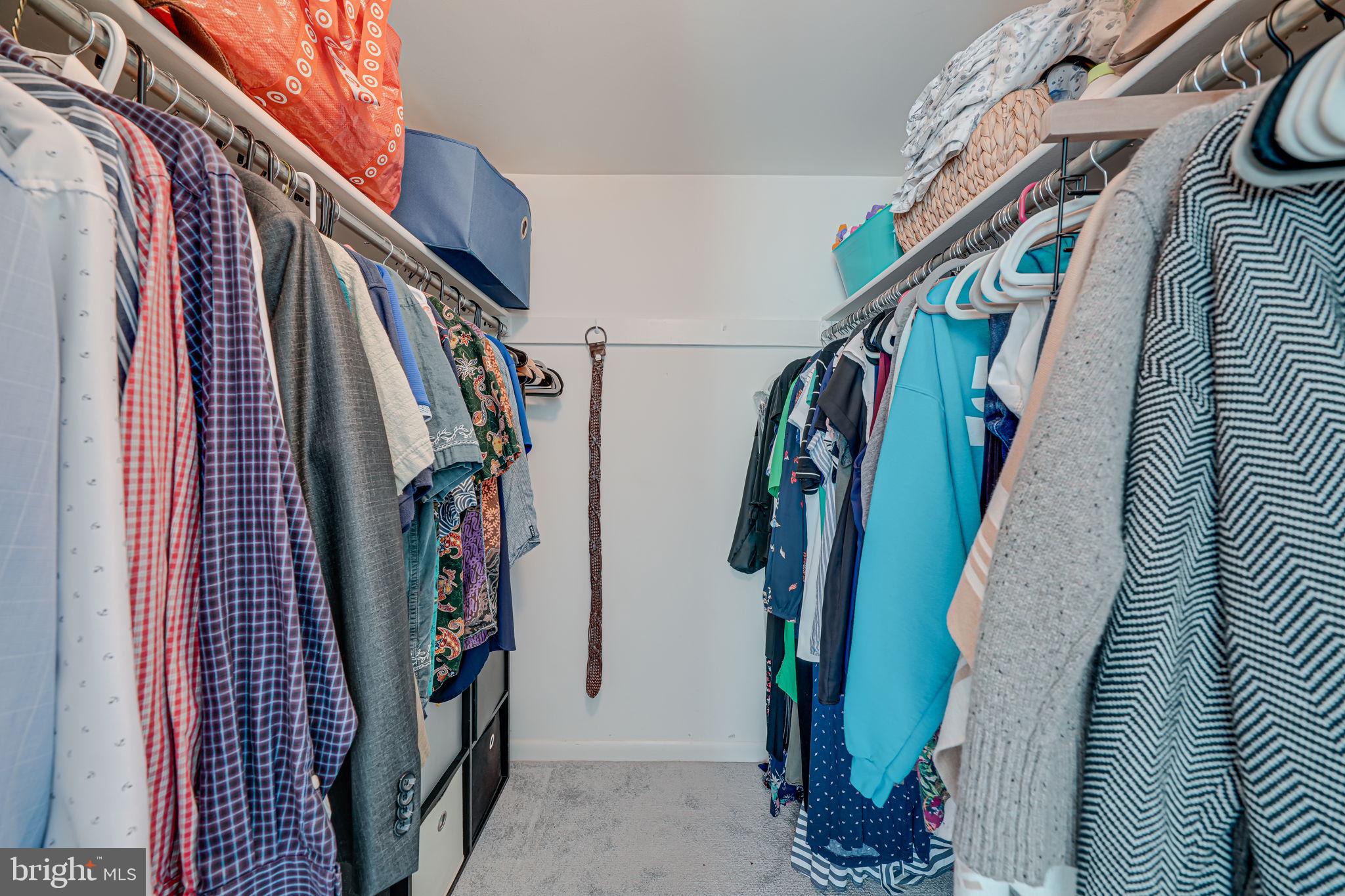 11220 Chestnut Grove Square, Unit 222 Reston, VA 20190 - Photo 25 of 35 a view of walk in closet with clothes and shoes