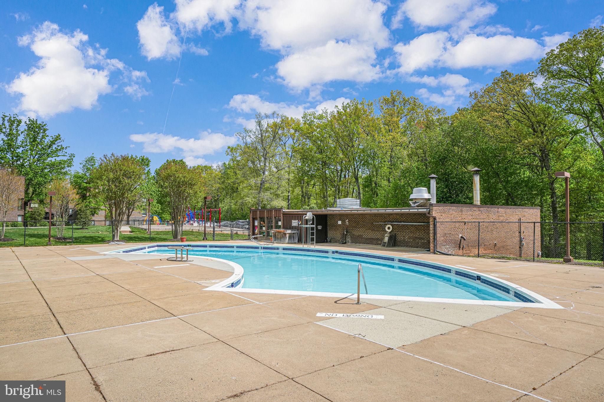 11220 Chestnut Grove Square, Unit 222 Reston, VA 20190 - Photo 32 of 35 a view of an outdoor space and tennis court