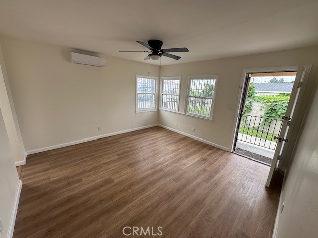 11220 Concert Street El Monte, CA 91731 - Photo 1 of 11 an empty room with wooden floor and windows