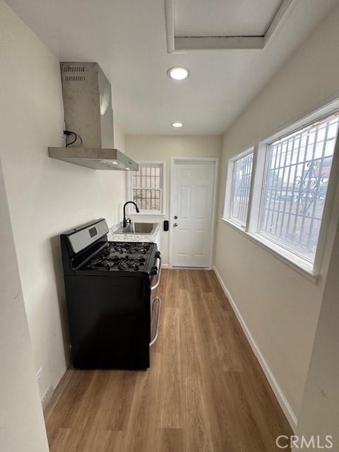 11220 Concert Street El Monte, CA 91731 - Photo 7 of 11 a kitchen with a stove and a refrigerator