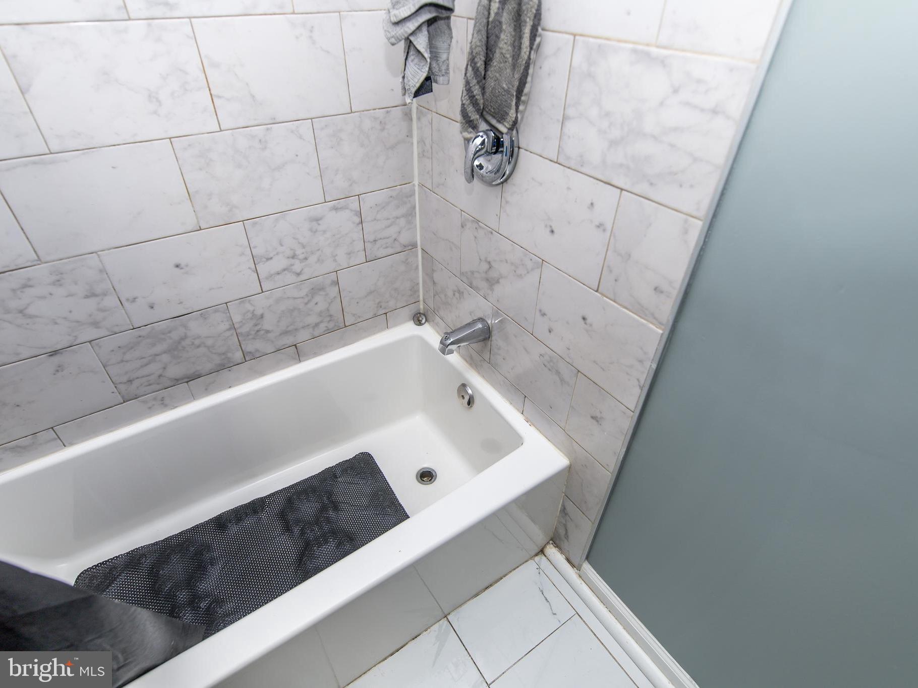 3934 Bel Pre Road, Unit 39342 Silver Spring, MD 20906 - Photo 14 of 30 a bathroom with a bathtub