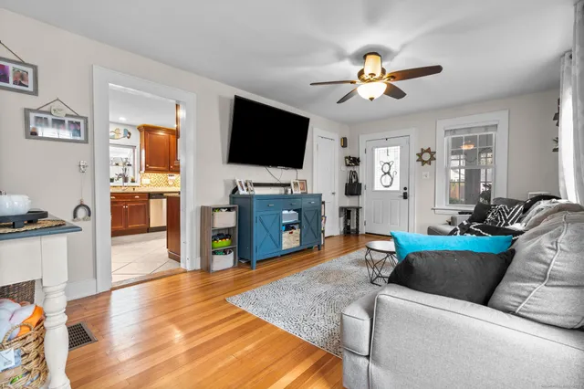 a bathroom with a toilet a sink and a mirror