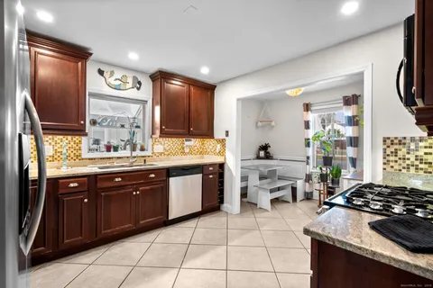a kitchen with a stove and a sink