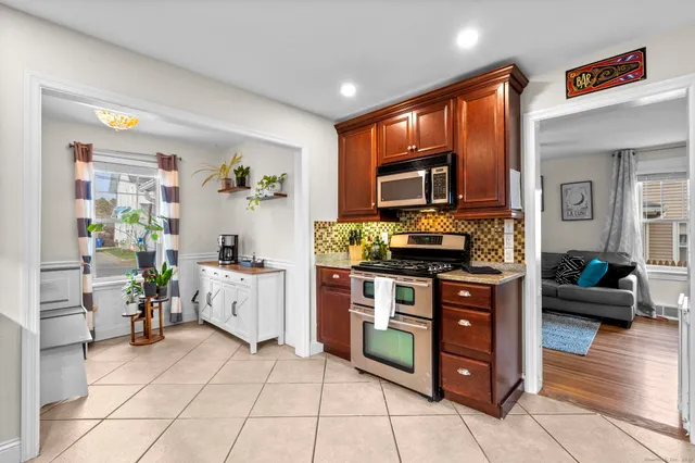 a kitchen with cabinets a sink and appliances