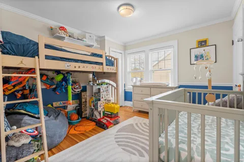 a bedroom with furniture and window