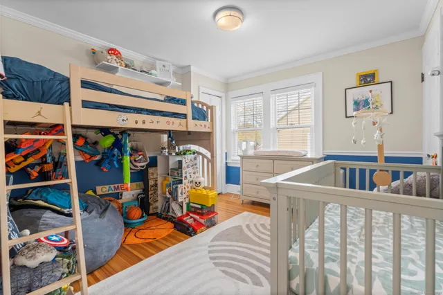 a bedroom with furniture and window