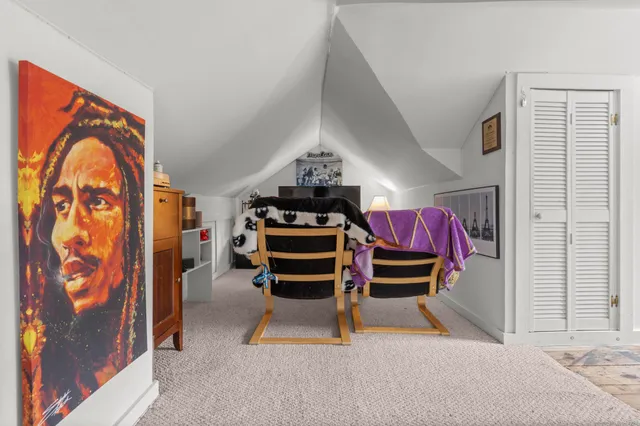 a room with furniture and air hockey table