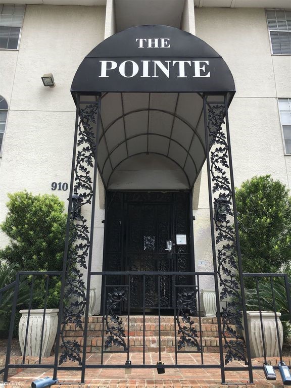 a front view of a house with large windows