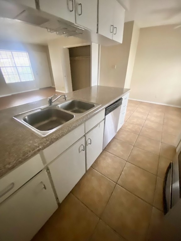 910 Duncan Lane, Unit 61 Austin, TX 78705 - Photo 11 of 22 a kitchen with a sink and cabinets