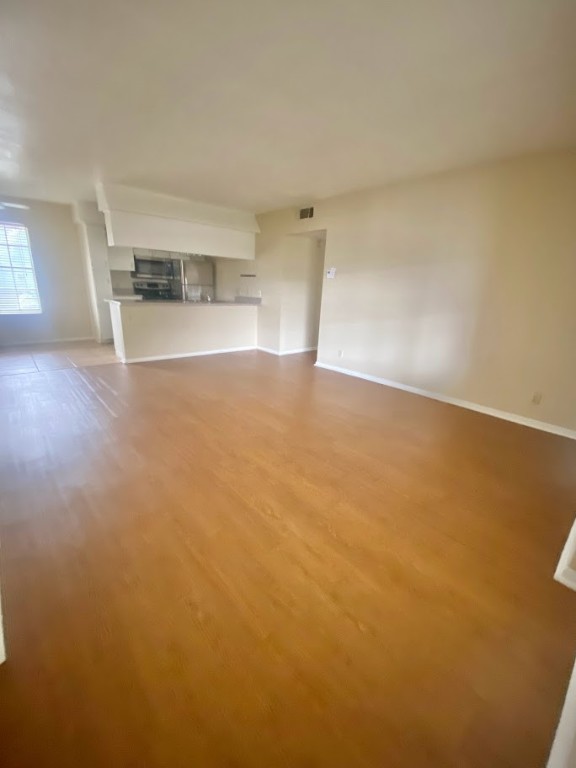 910 Duncan Lane, Unit 61 Austin, TX 78705 - Photo 4 of 22 a view of empty room with kitchen