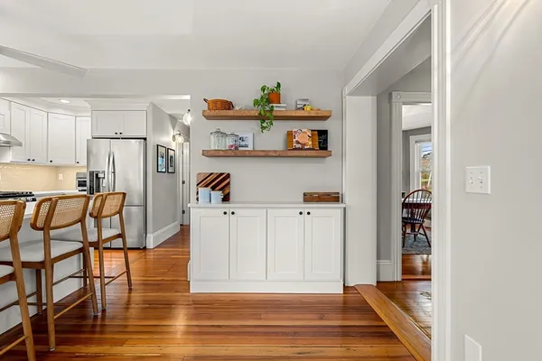 a view of kitchen with furniture and wooden floor