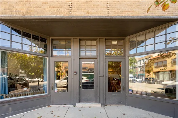a front view of a building with a glass door