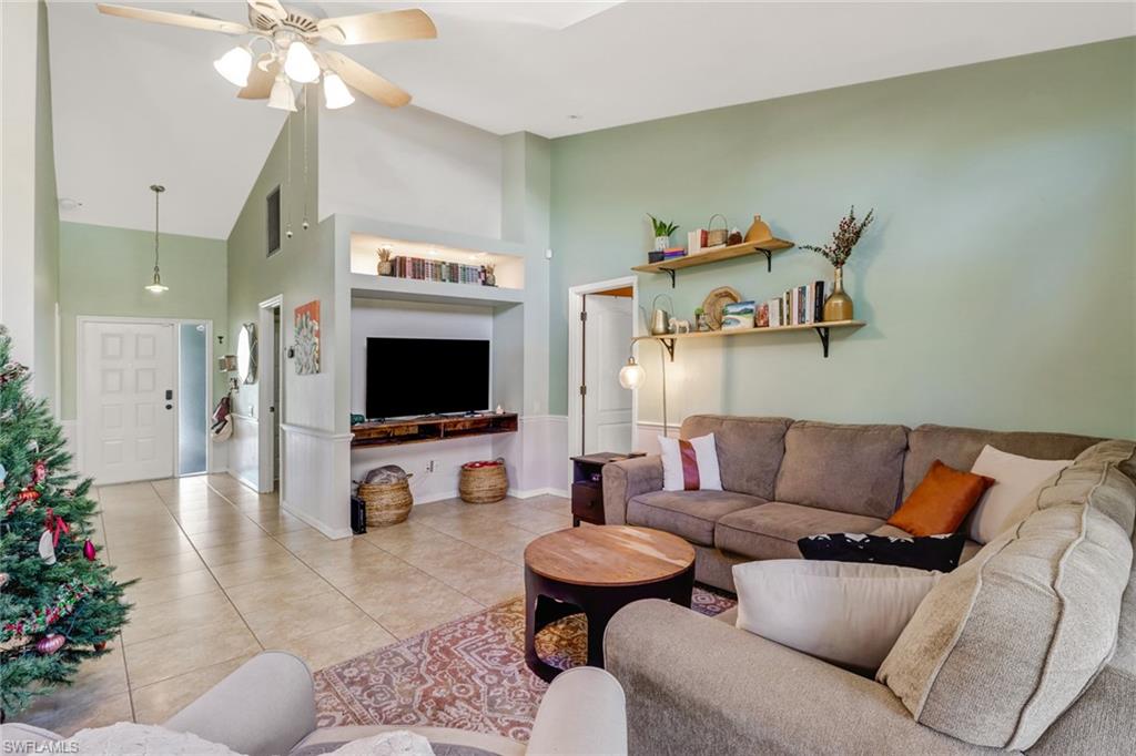 13162 Heather Ridge Loop Fort Myers, FL 33966 - Photo 5 of 25 a living room with furniture and a flat screen tv