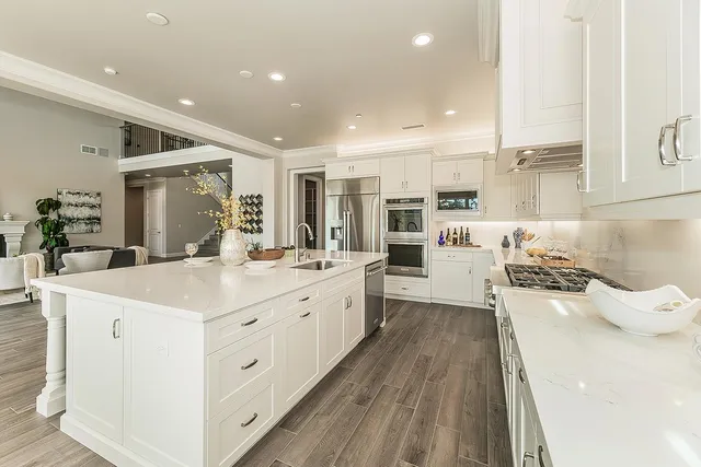 a kitchen with a stove and a refrigerator