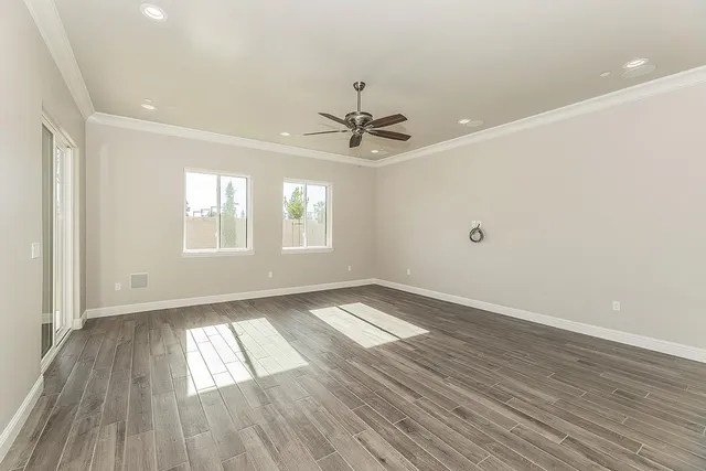 a bathroom with a granite countertop toilet a sink a mirror and shower