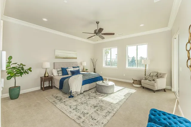 en empty room with a window and a fan