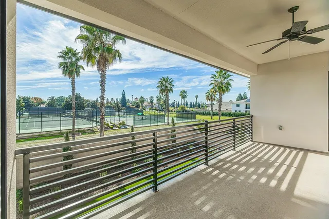 a bathroom with a granite countertop sink a large mirror and a shower