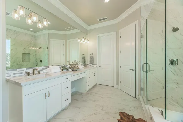 a bathroom with a double vanity sink mirror and next to a window