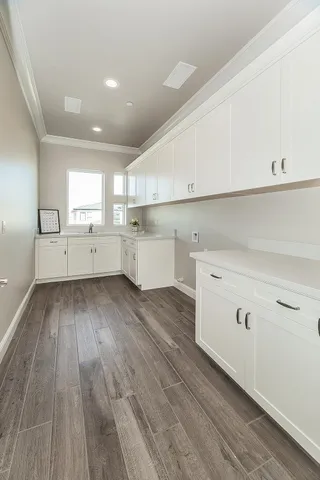 a front view of a house with a yard table and chairs