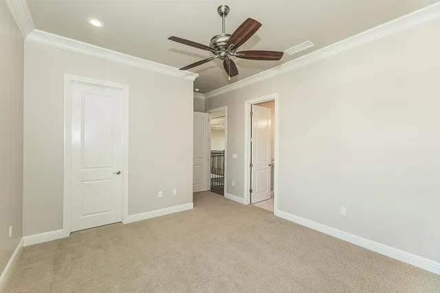 a view of a garden with a building in the background