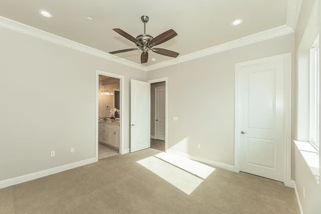 a view of a house with a yard and potted plants