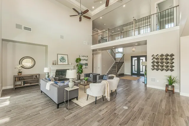 a kitchen with a sink stove cabinets and wooden floor