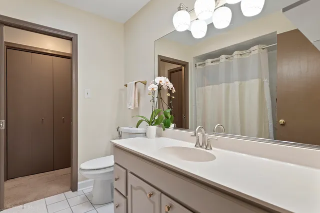 a bathroom with a sink a mirror and a shower