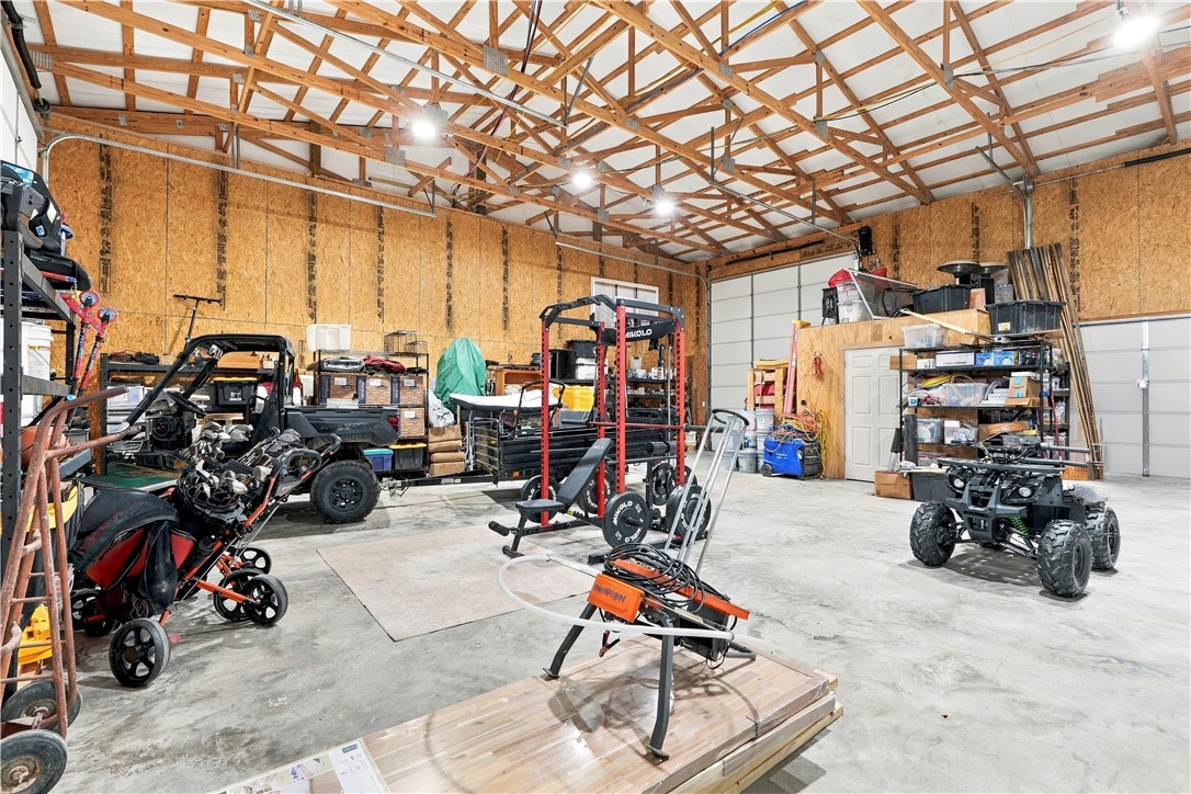 8800 Fred Austin Road Decatur, AR 72722 - Photo 60 of 60 Main garage attached to home, plenty of room for all your toys. Also a 14ft pull thru doors for your boat or RV.